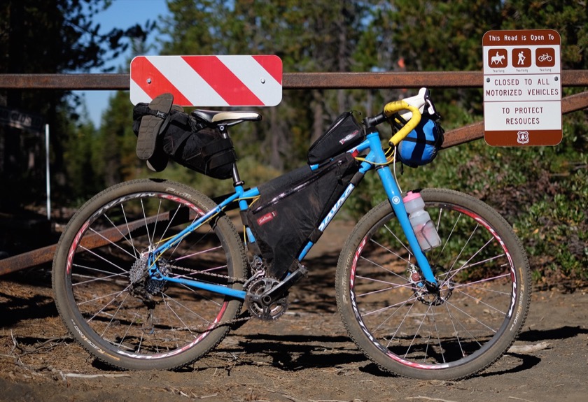The seat bag held my sleeping bag, pillow, and clothes. The frame bag held my tent poles, food, and toiletries. The gas tank (the bag on top of the top tube behind the stem) held my raisins. The handlebar bag held my tent, tent fly, and sleeping pad. I also wore a backpack which held my camera, phone, wallet, an extra lens, and 60 ounces of water.