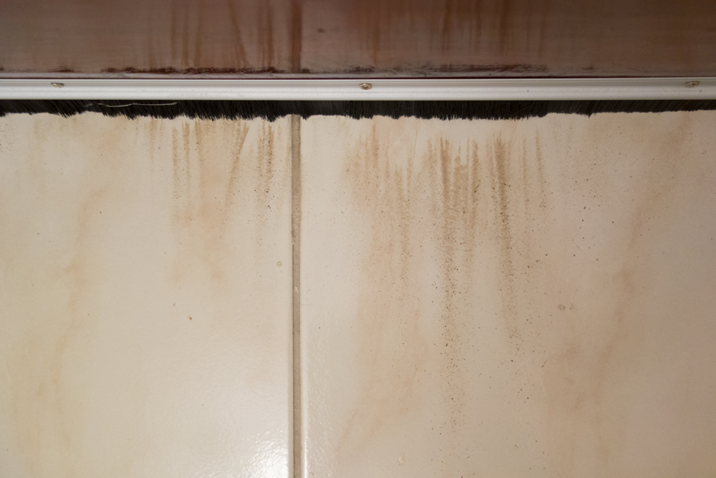 Dust blows in under the door